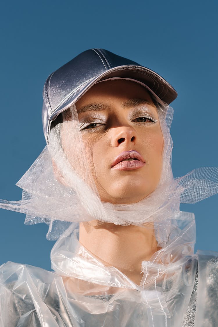 A Woman With Sheer Fabric Wrapped On Her Head