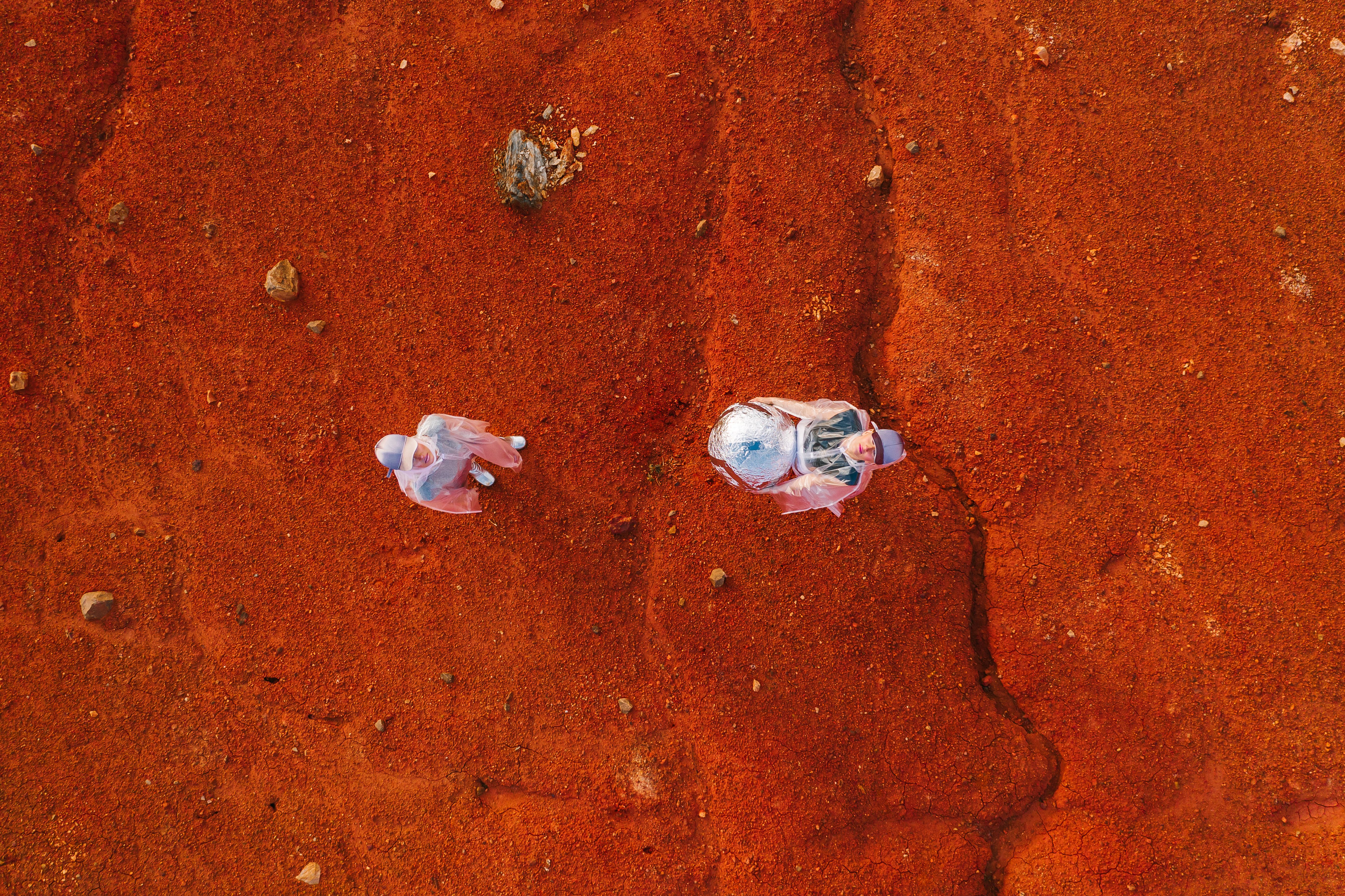 Red cracked outback earth under a wide sky