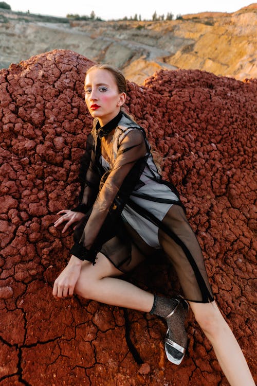 Young Woman Posing at a Futuristic Fashion Shoot in an Area of an Open Pit Mine 
