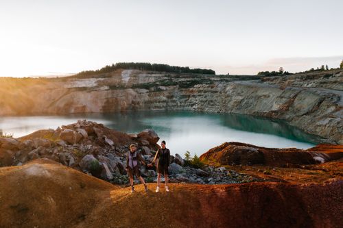 Free Models posing in a scenic quarry in Russia, showcasing fashion against a dramatic landscape. Stock Photo