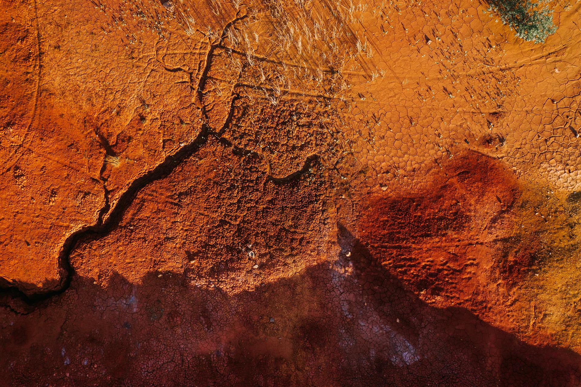 Aerial view of a dry, cracked landscape in Kemerovo, Russia showcasing natural textures.