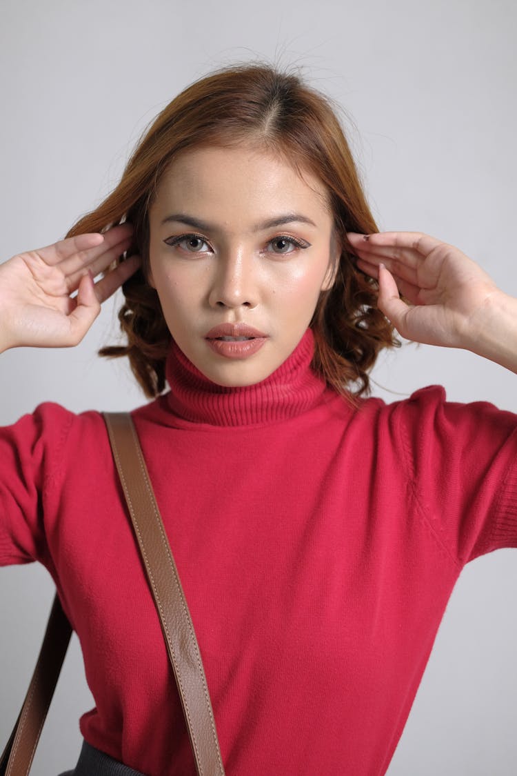 Portrait Of Woman With Short Hair And Red Turtleneck