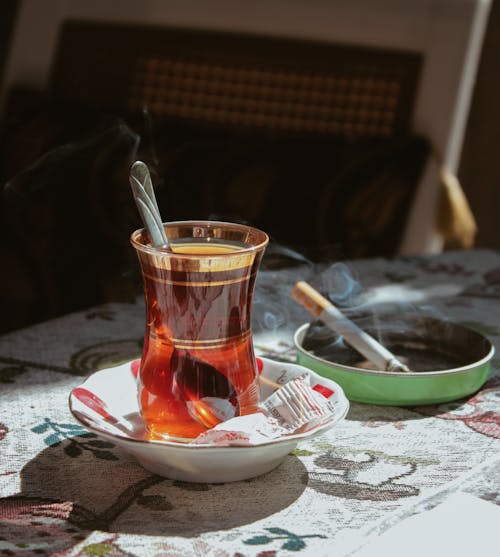 Glass of Tea Near a Cigarette