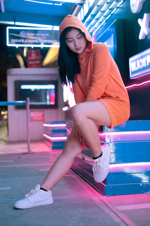 Woman in an Orange Hoodie Posing