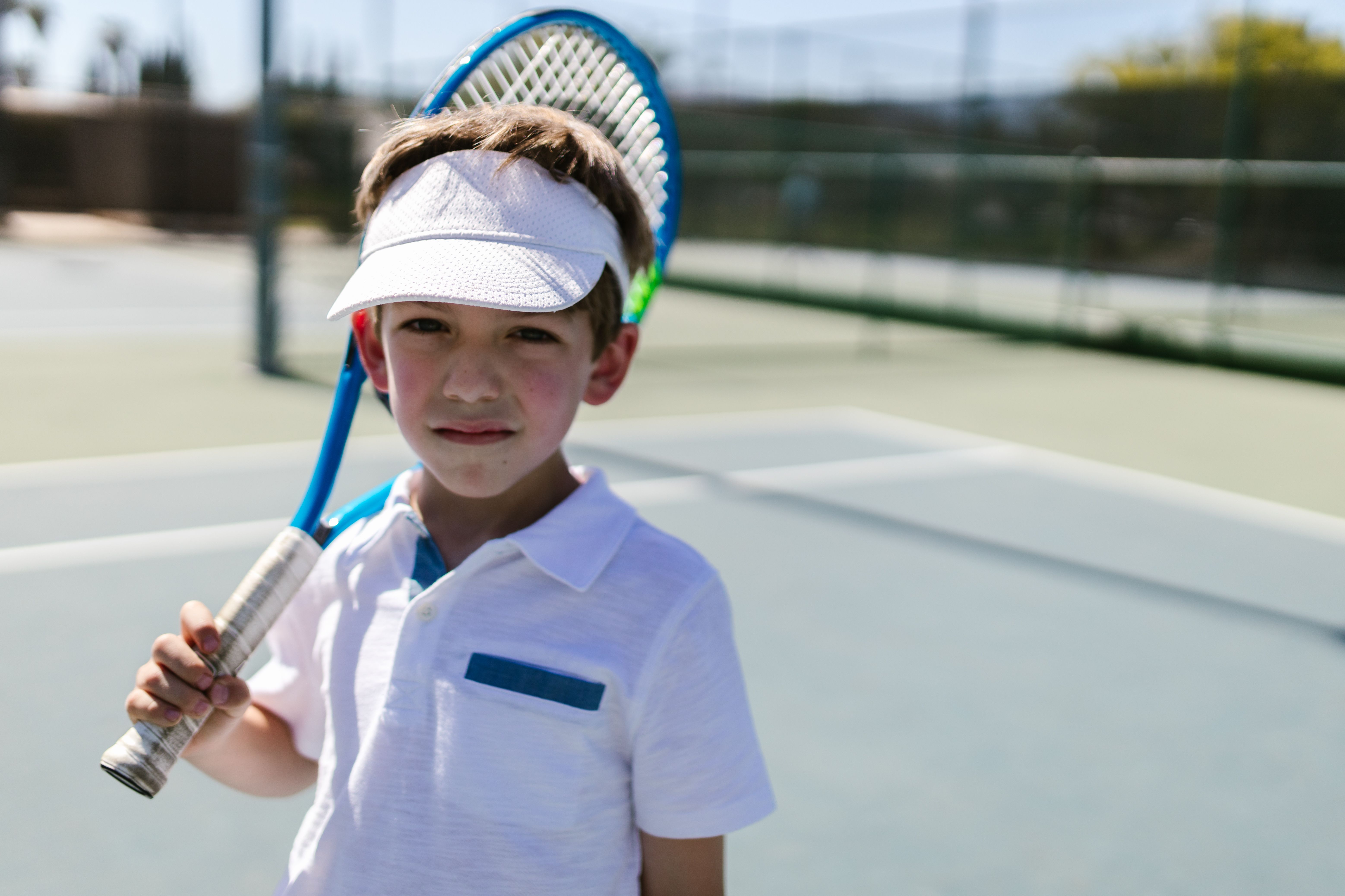Boy in Sportswear Holding His Tennis Racket · Free Stock Photo