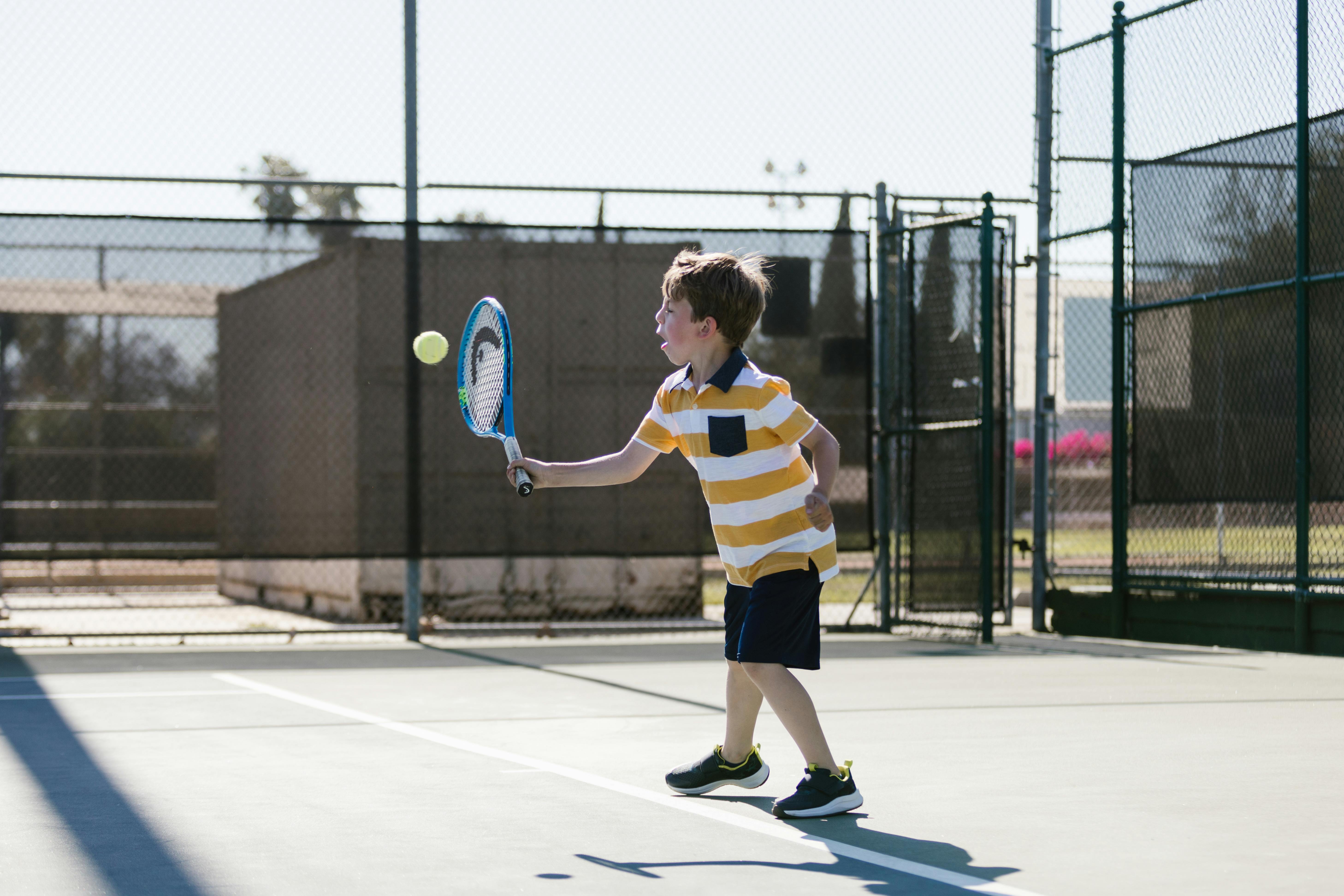 Free Boy Playing Tennis Stock Photo