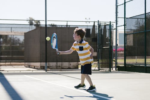 Boy Playing Tennis