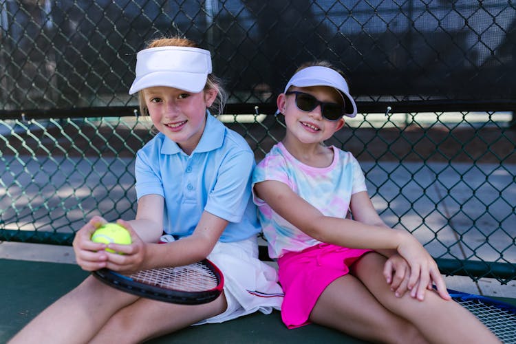 Girls Taking A Break From Tennis