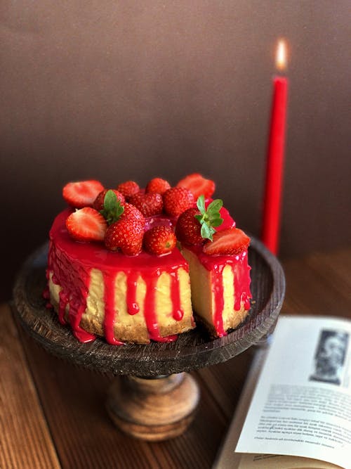 Appetizing cake with strawberries on holder