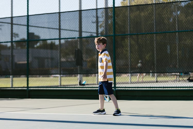 Boy Playing Tennis