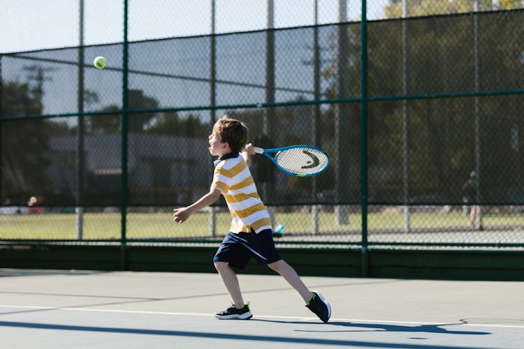 Boy Playing Tennis