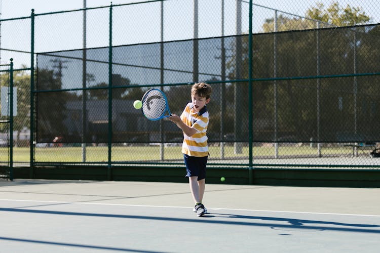 Boy Playing Tennis