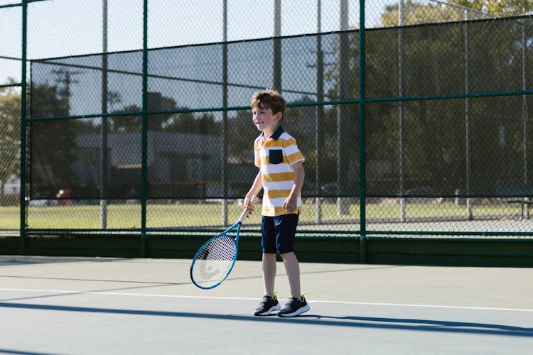 Boy Playing Tennis