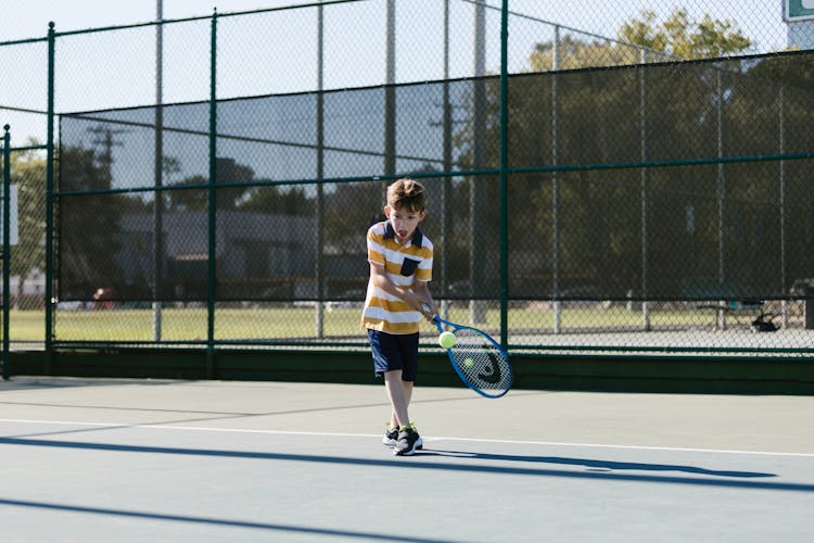 Boy Playing Tennis