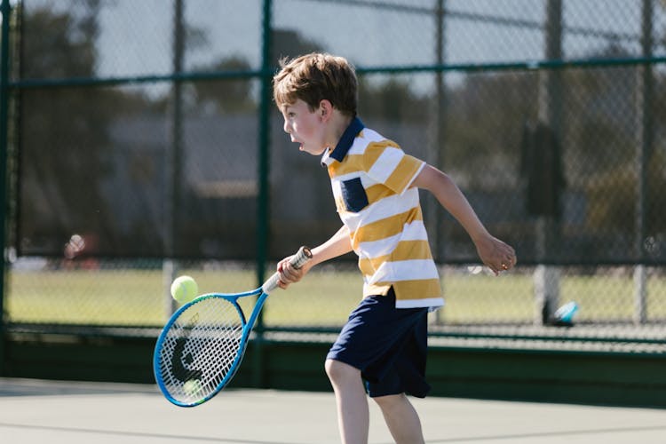 Boy Playing Tennis