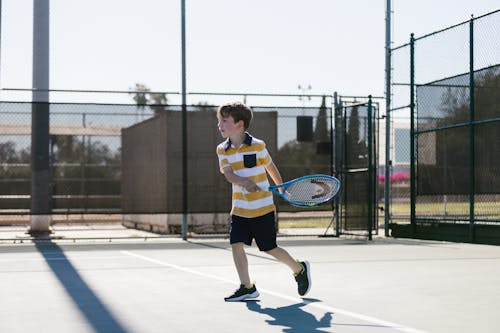 Boy Playing Tennis