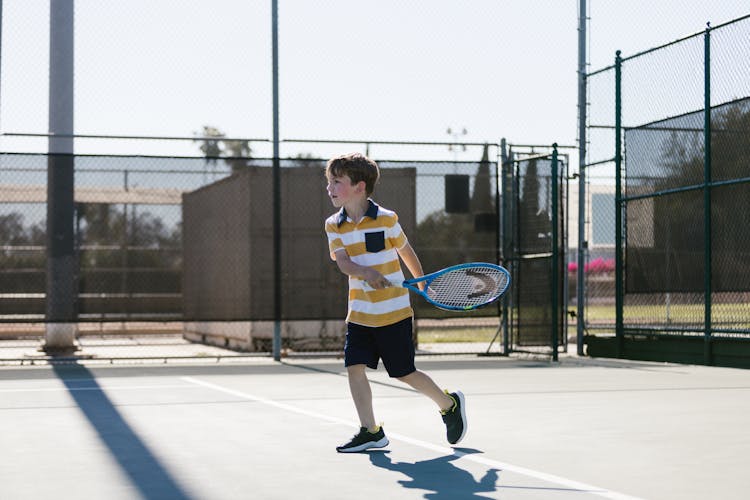 Boy Playing Tennis