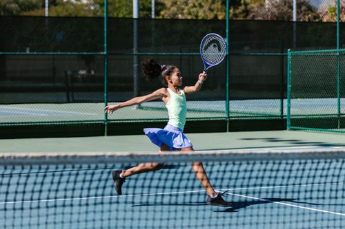 Woman Holding Tennis Racket · Free Stock Photo