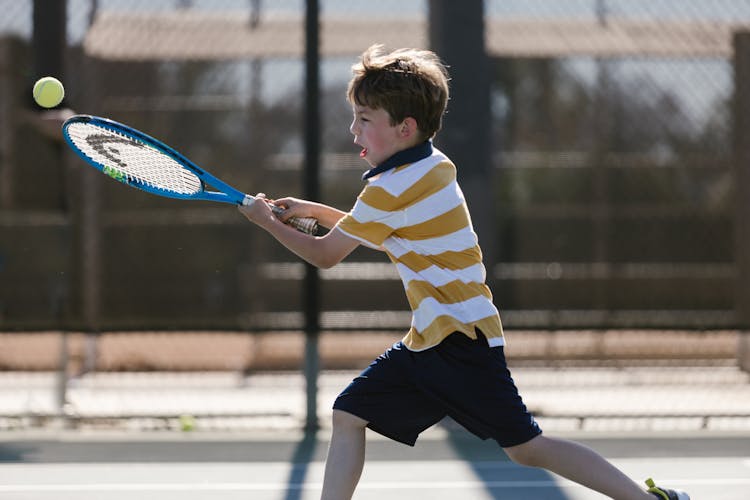 Boy Playing Tennis