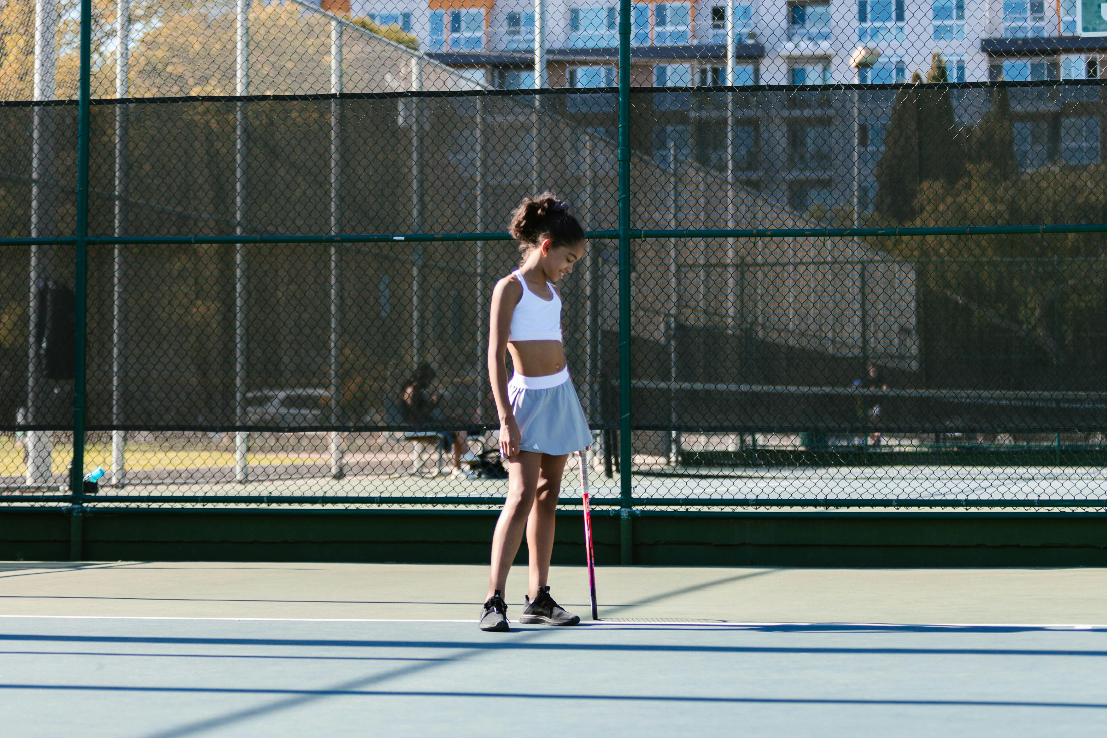 girl playing tennis