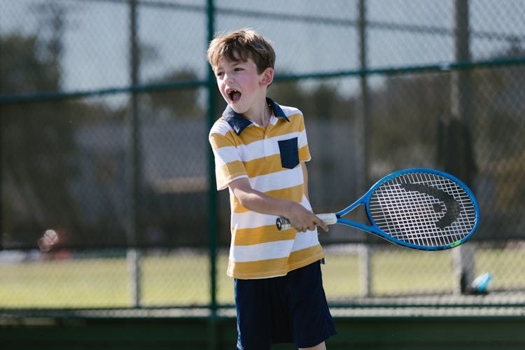 Boy Playing Tennis