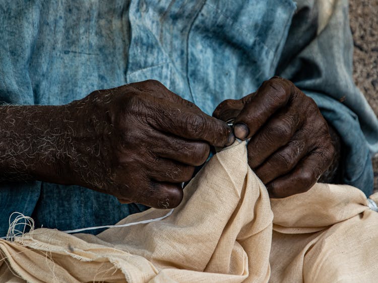 Hands Sewing Clothes