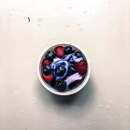 Flat Lay Photo of Berries in Container