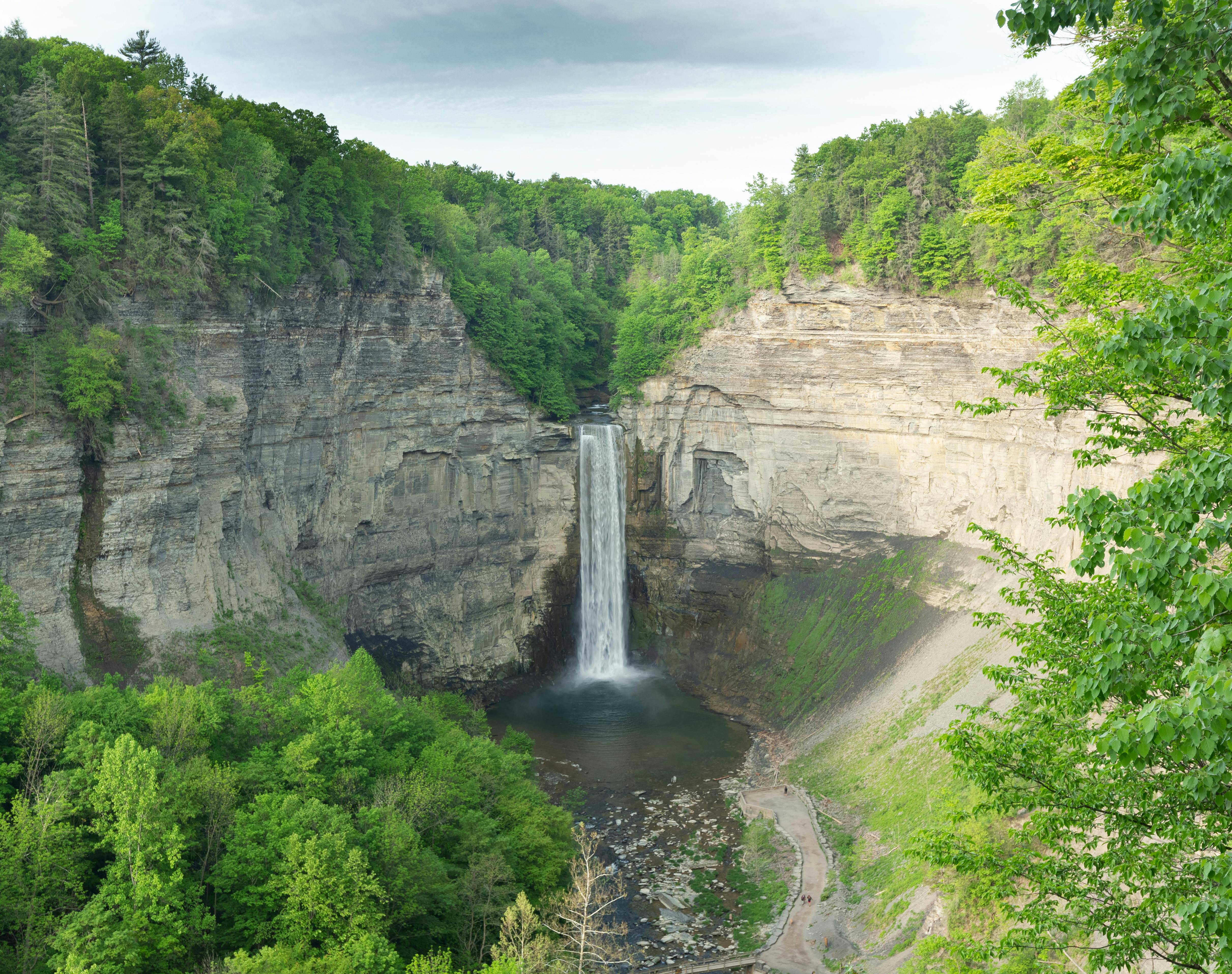 A breathtaking aerial shot of Taughannock Falls surrounded by lush greenery in New York.