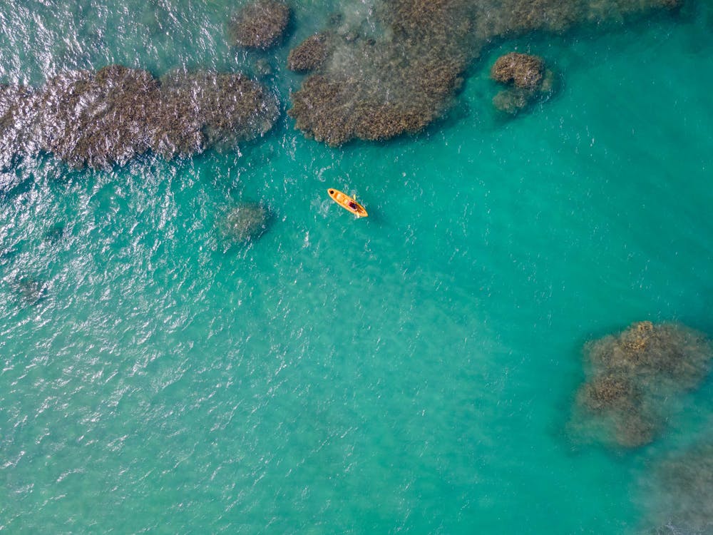 Aerial View of a Kayak on the Sea