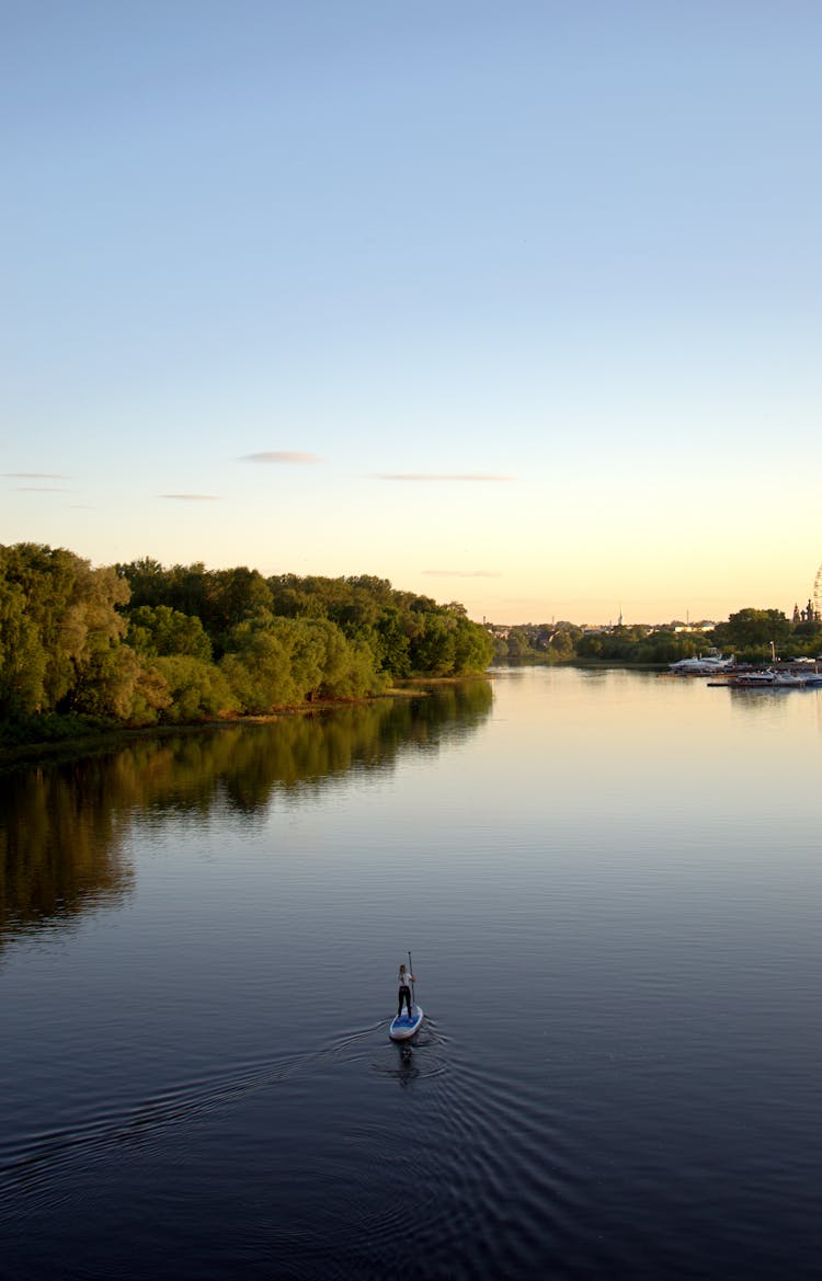 Person Sailing On Sup In River