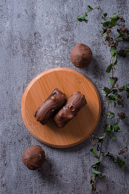 Free Chocolate Products on a Wooden Cutting Board  Stock Photo