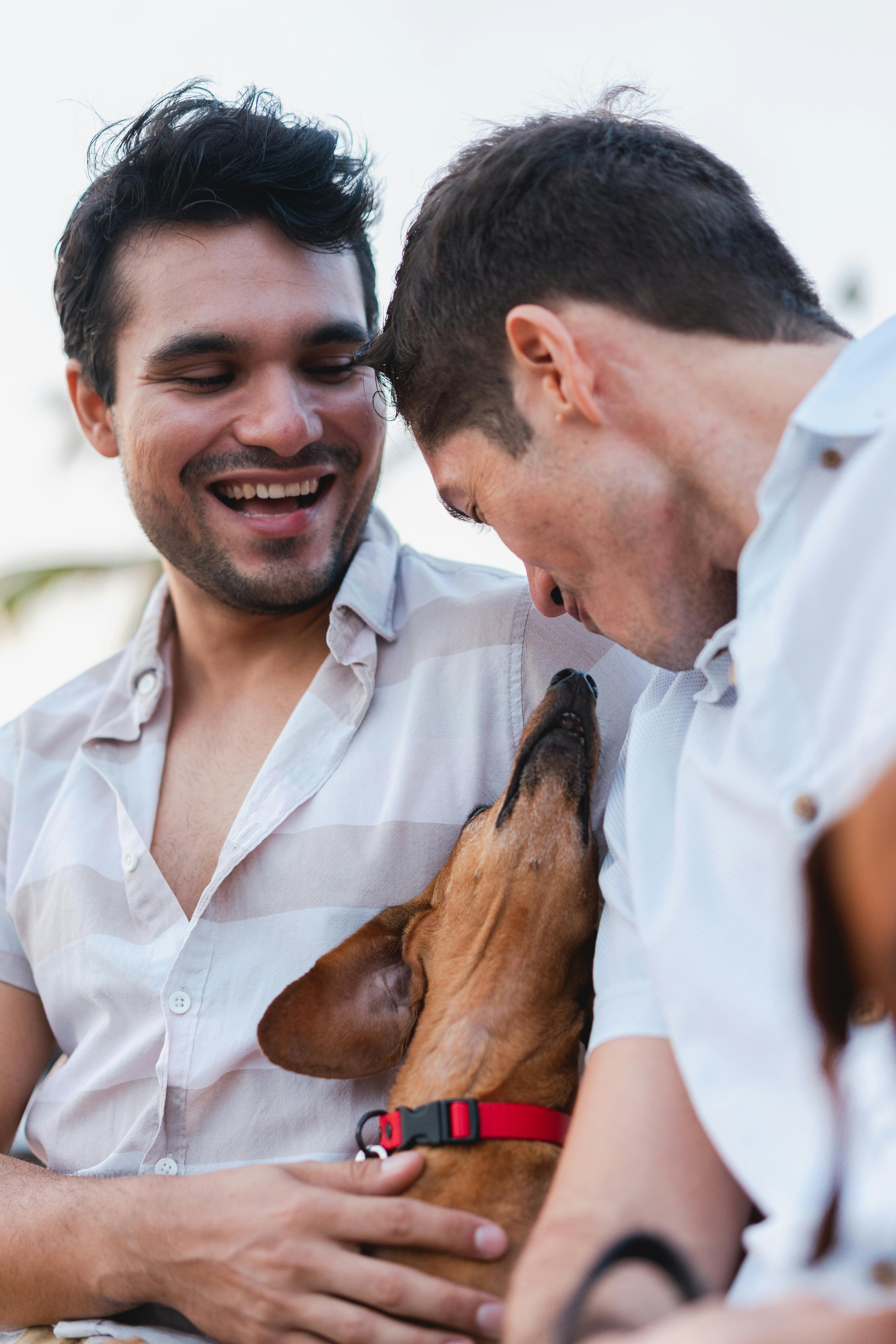 Happy couple spending quality time outdoors with their beloved dog.