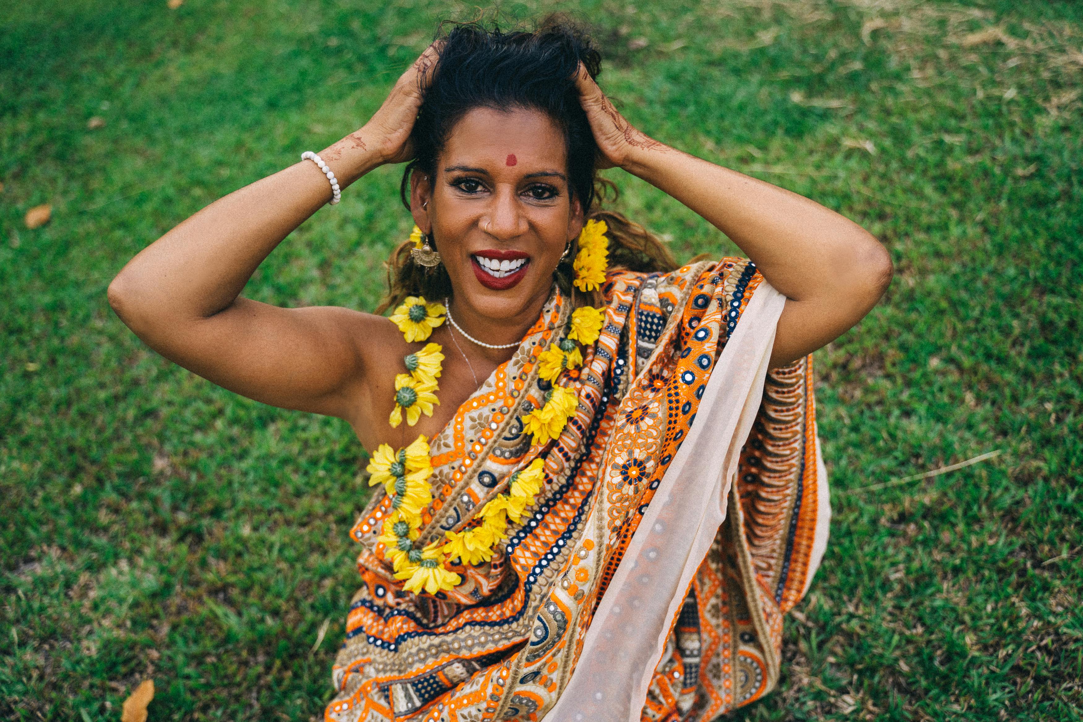 Woman in Yellow and Blue Floral Dress Smiling