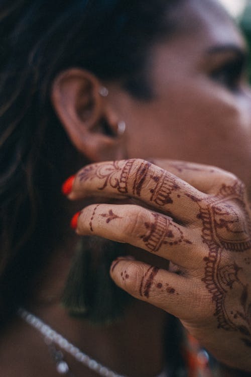 Free Hand of a Woman with Mehndi Tattoo Stock Photo