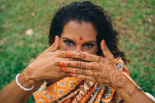 Close-up Photo of Woman in Traditional Hand Tattoo