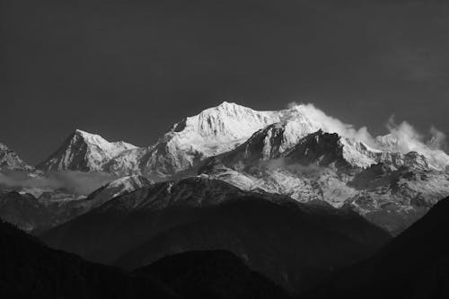 Grayscale Photo of Snow Covered Mountain