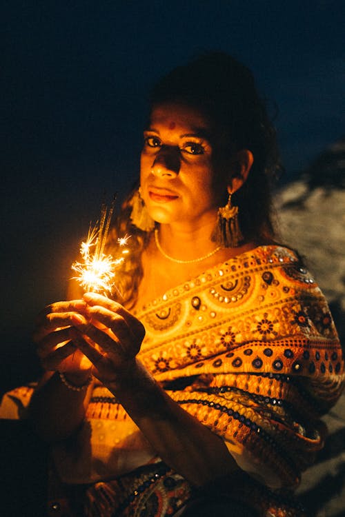 A Woman Holding a Sparklers