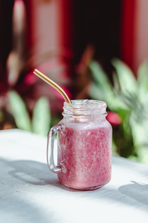 Free Smoothie Clear Glass Jar on White Table Stock Photo