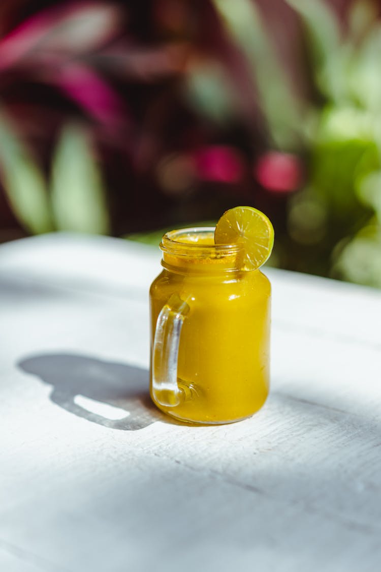 A Fruit Smoothie In A Mason Jar