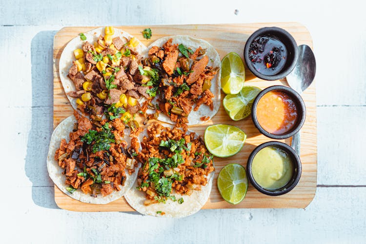 Close-Up Shot Of Tacos On A Wooden Tray