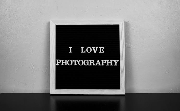 A Board With Writing Saying I Love Photography