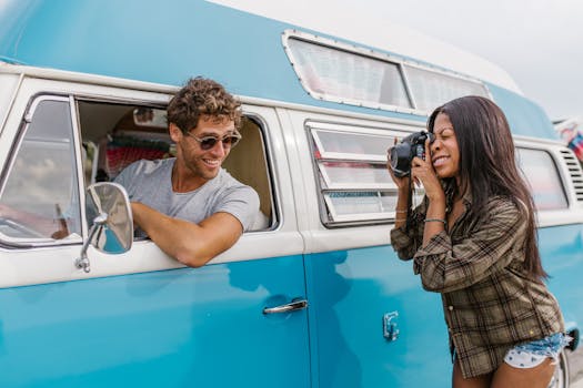 A couple enjoys a road trip with a vintage van, capturing playful memories and adventure.
