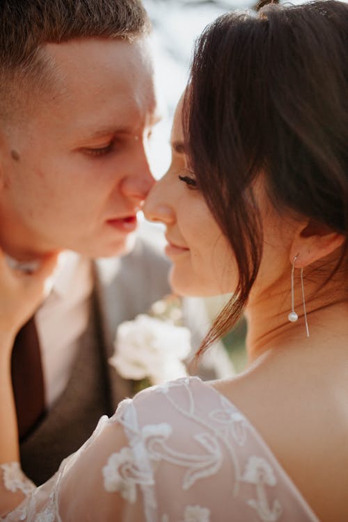 Close-up of Portrait of Bride and Groom Almost Kissing 