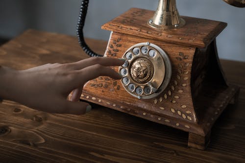 Free Close-Up Shot of a Person Using a Classic Rotary Phone Stock Photo
