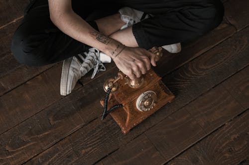 Free High-Angle Shot of a Person Using a Classic Rotary Phone Stock Photo
