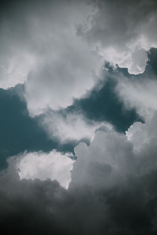 Free Captivating vertical shot of dark, dramatic cloud formations in an overcast sky. Stock Photo