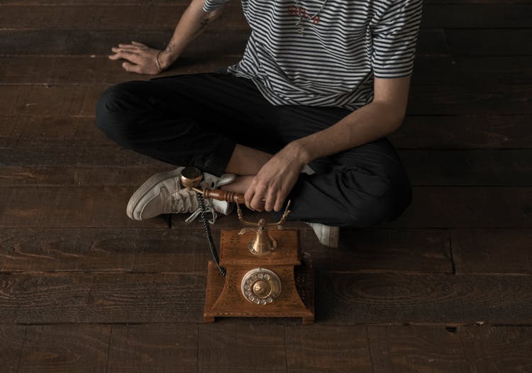 Person Holding Vintage Phone