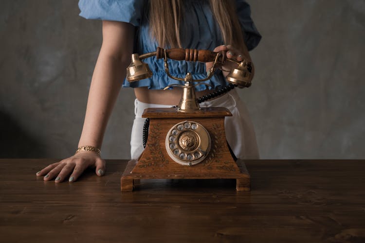 Woman Holding Vintage Phone