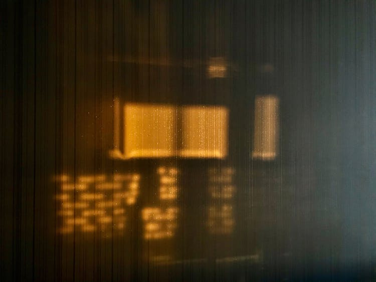 Sunlight And Shadows On A Wooden Paneling On A Wall 