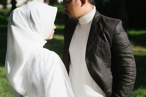 A Man and a Woman Dressed in Their Wedding Clothes